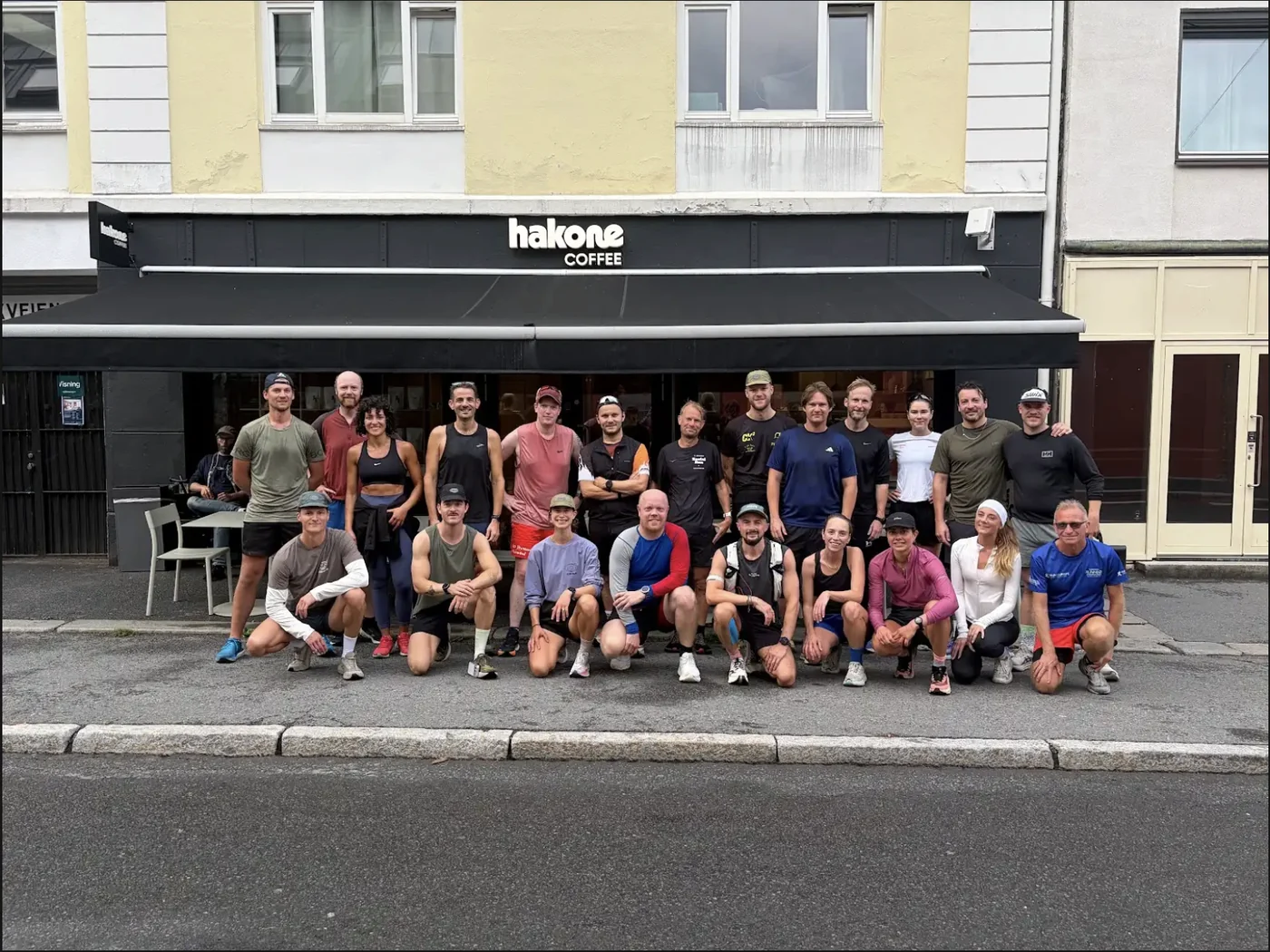 Hakone Run Club members posing in front of Hakone Coffee in Oslo